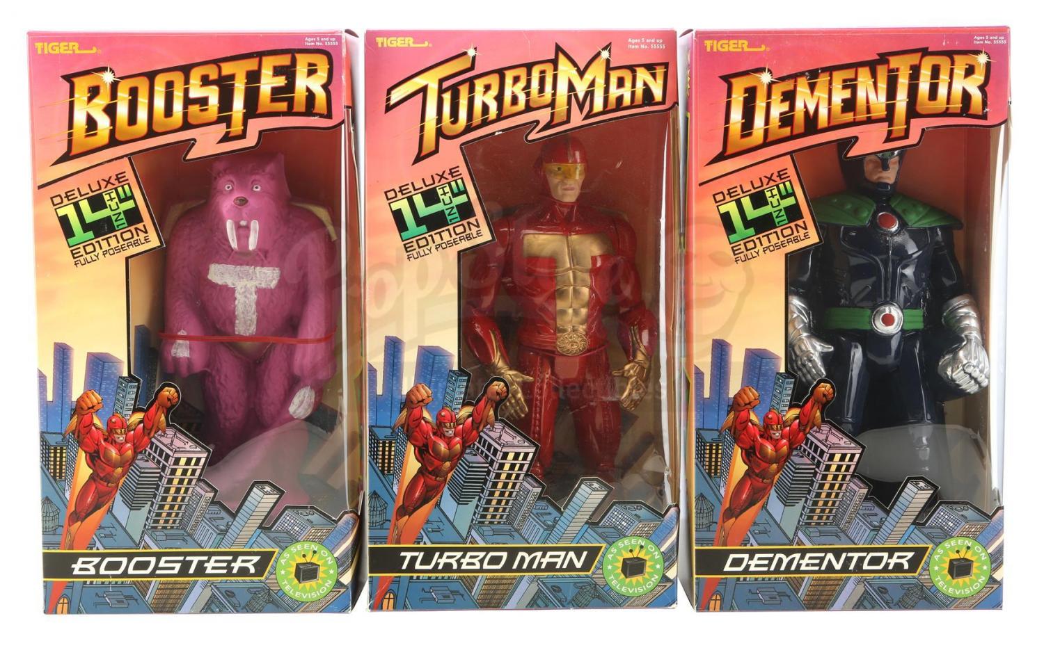 Lot #392 - JINGLE ALL THE WAY (1996) - Set of Boxed TurboMan, Booster and  Dementor Figures