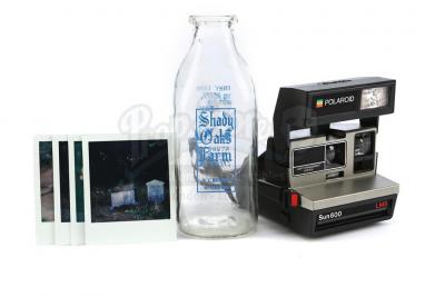 Lot # 76: THE HAUNTING OF HILL HOUSE - Young Shirley Crain's Instant Camera with Photos and Milk Jar