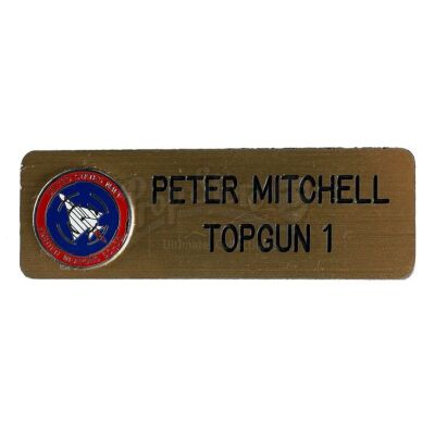 Lot # 387: TOP GUN (1986) - Pete "Maverick" Mitchell's (Tom Cruise) Uniform Nameplate